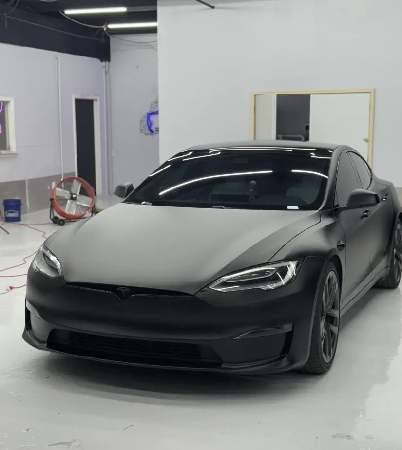 Photo of a black Tesla, showing luxury European car with high-gloss finish after professional detailing at GB Motors Dallas TX